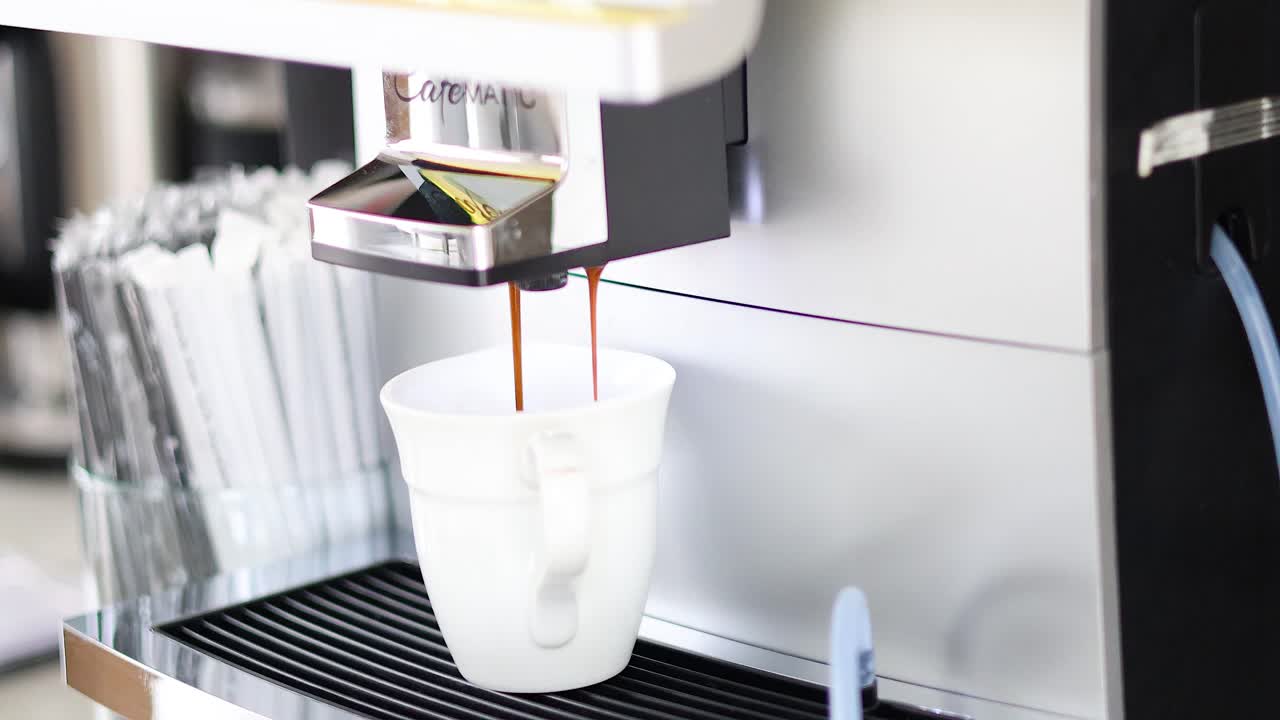 Sequence of coffee being dispensed into a cup