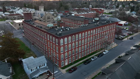 manufacturing factory building converted to residential rental apartment condo living quarters in small town america