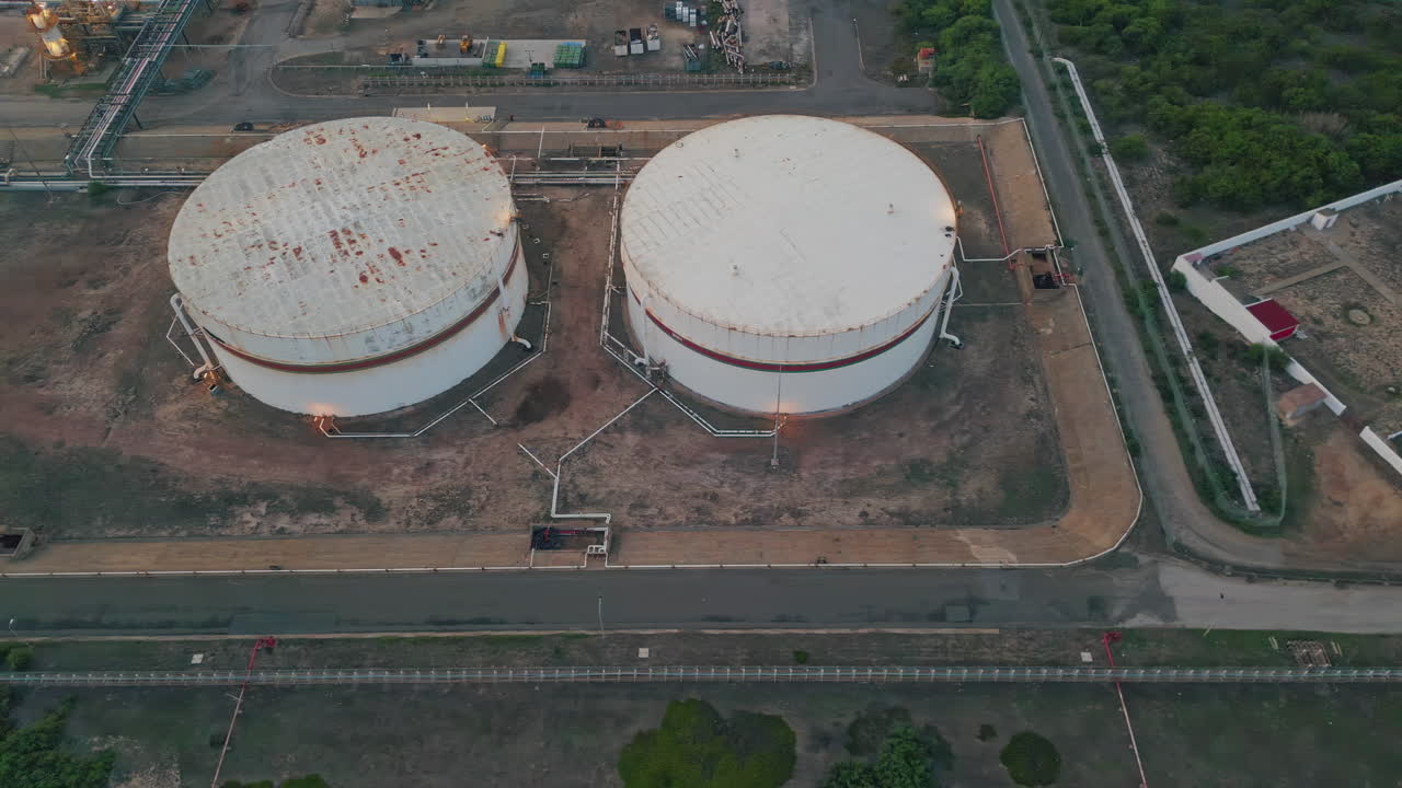 Crude oil depot facility at petrochemical factory. Drone flying energy plant