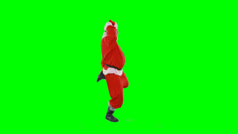 Santa-claus-dancing-against-green-background