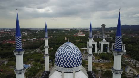 aerial footage - flyover a mosque on a cloudy day.