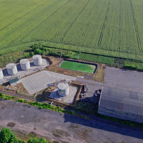 aerial view of an abandoned industrial site in a sunflower field