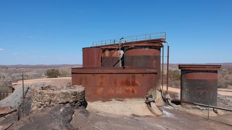 Drone-fly-over-of-rusty-water-tanks