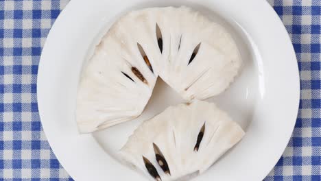 Soursop-fruit-on-a-plate-on-table-,