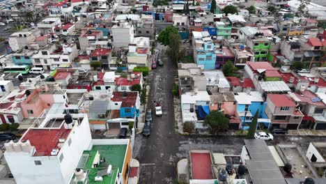 slow-motion drone shot of pothole-ridden streets of ecatepec