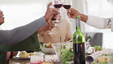 happy african american family having christmas dinner