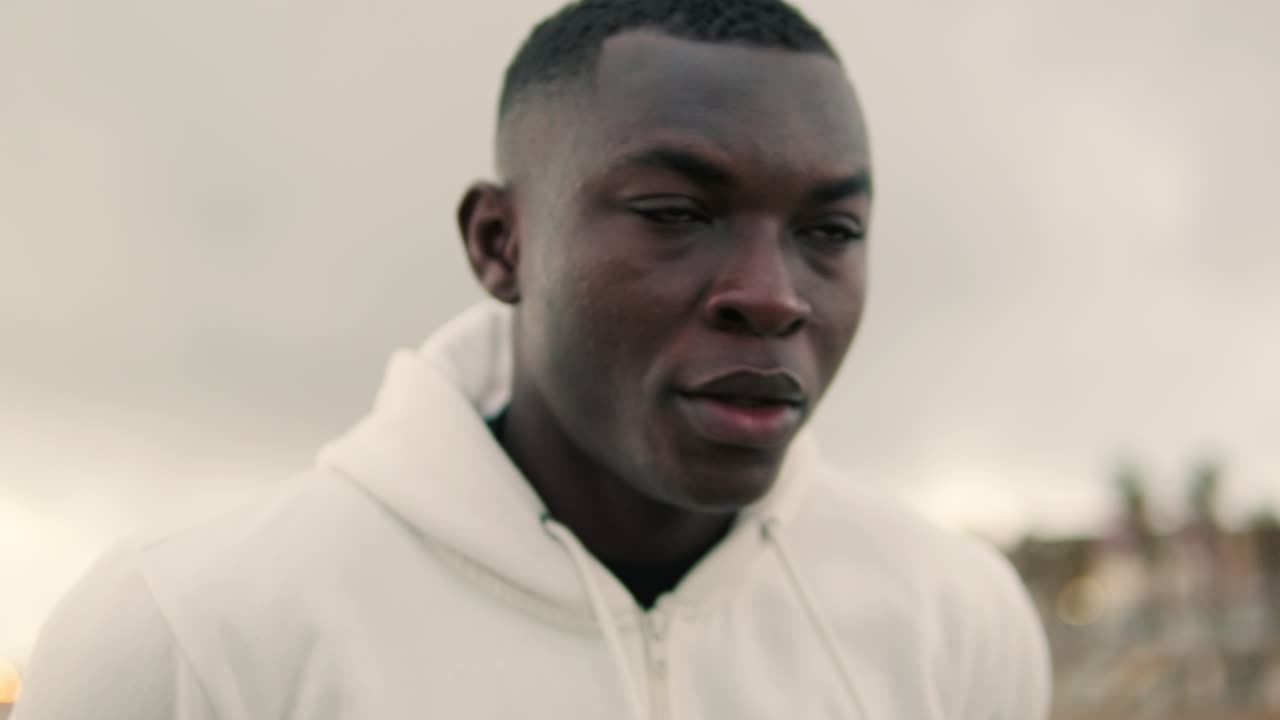 Close-up of young African American man exercising outdoors