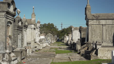 empty graveyard lined with mausoleums in the us south