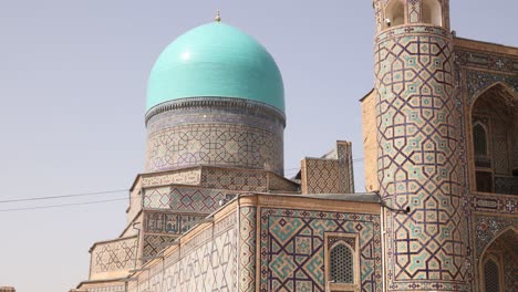 bright-blue-islamic-domes-ornately-tiled-minarets-in-Samarkand,-Uzbekistan-along-the-historic-Silk-Road