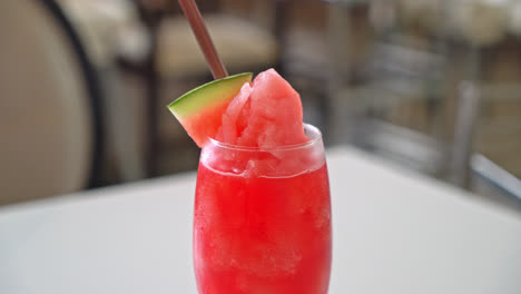 fresh watermelon smoothie glass on table in cafe restaurant