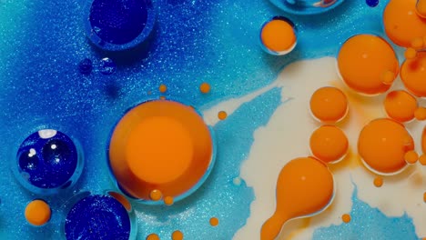 abstract blue and orange swirling patterns in oil and water