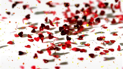 animación de confeti cayendo y corazones rojos sobre fondo blanco