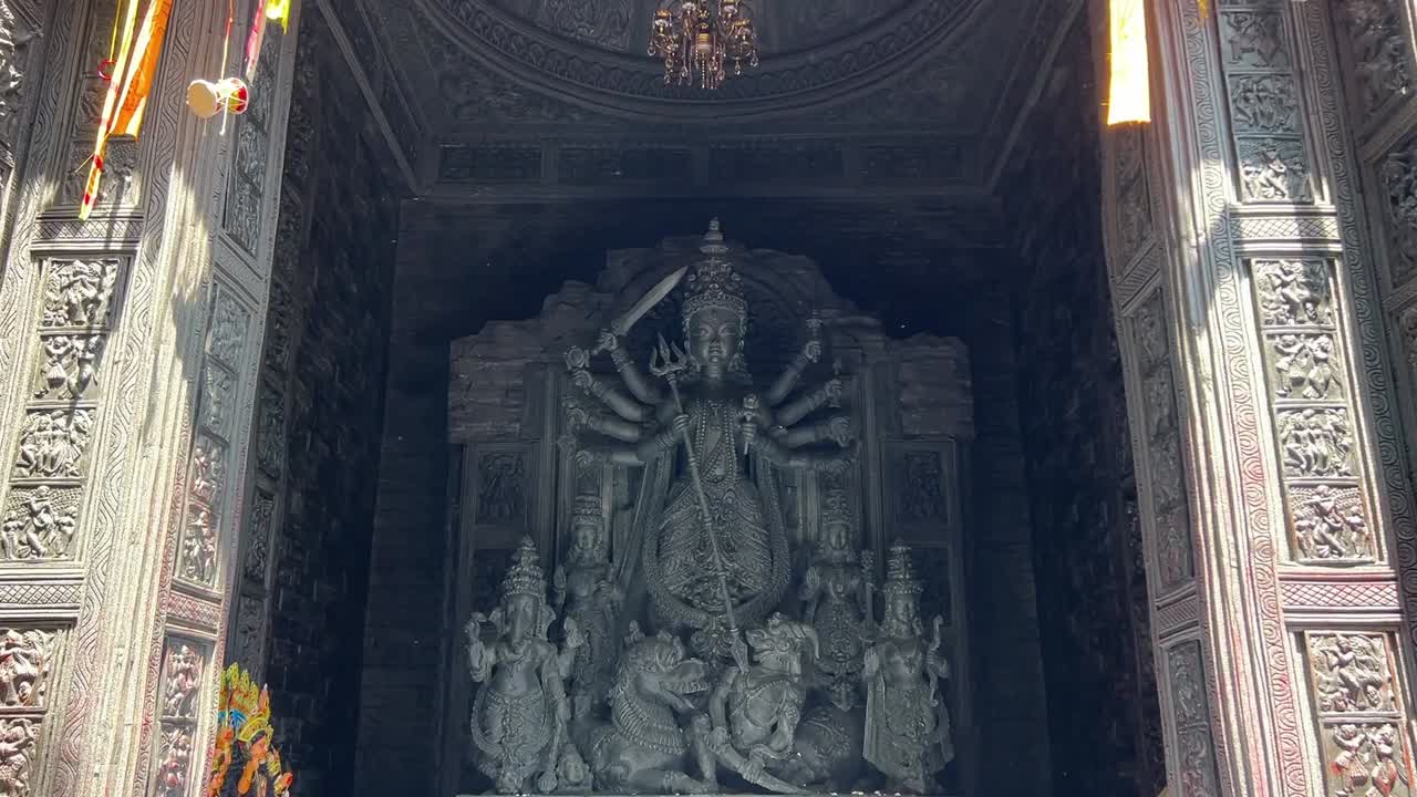 An old black stone Durga maa idol in Himalaya, India