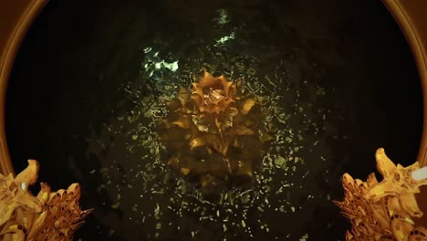 dolly in of a golden wishing well in wat rong khun or white temple in chiang rai, thailand