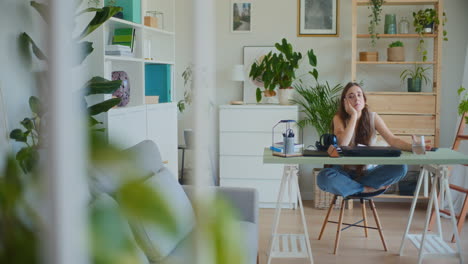 Contemplative-Woman-Holding-Glass-Water-Reflective-Sitting-Desk