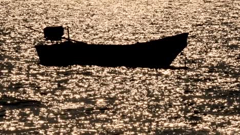 a boat floats on shimmering pattaya waters