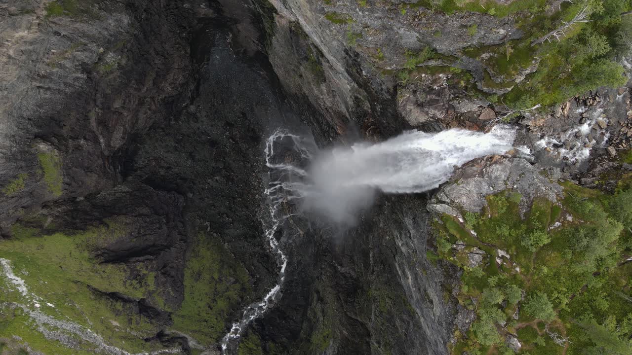 Closing up from above drone footage of the famous Vettisfossen waterfall in Norway