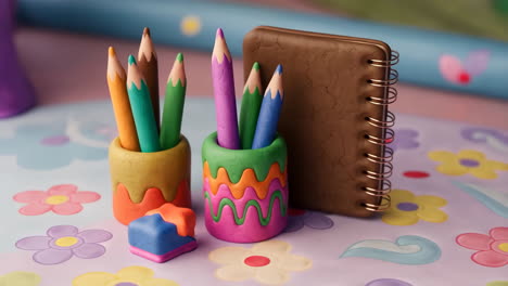 colorful clay stationery set with pencils, notebook, and eraser
