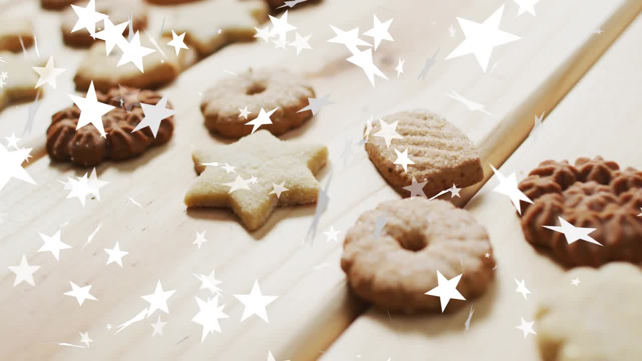 Slow panning over butter cookies while stars drifting and focus shifting to showcase assortment