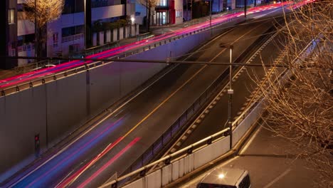 a night timelapse of the traffic jam at the city street in tokyo