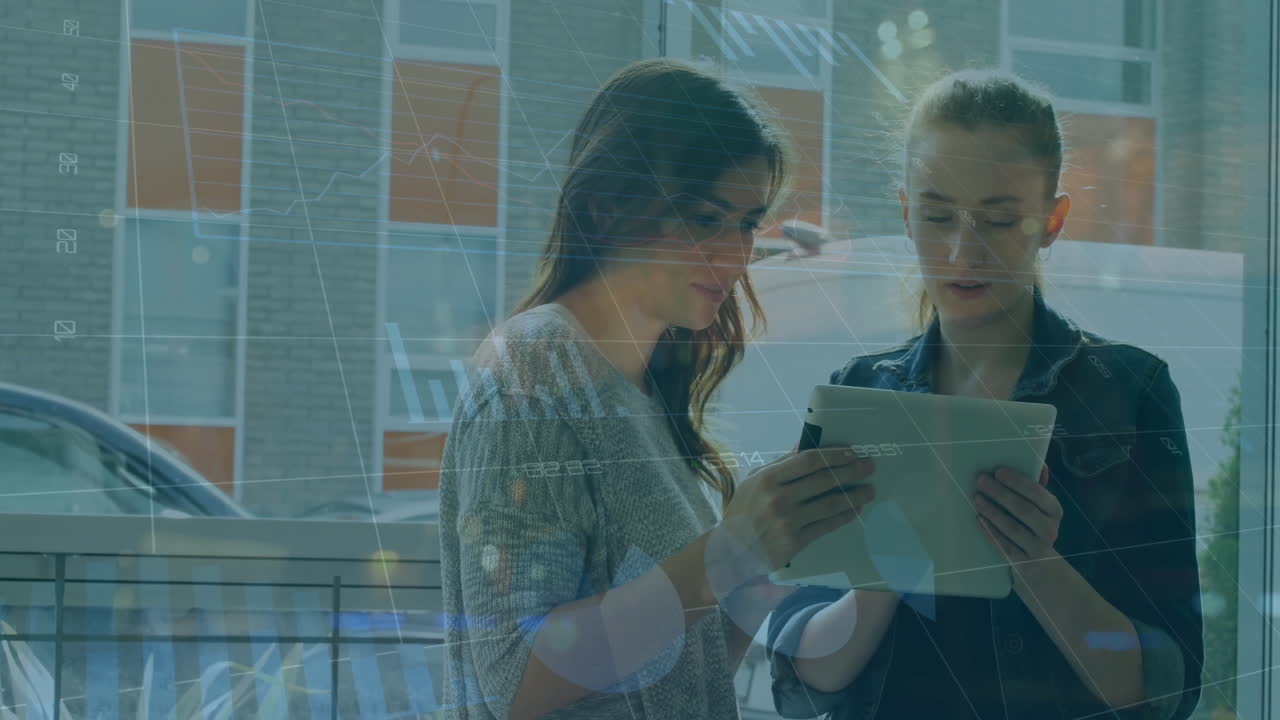 Animation of infographic interface over caucasian female colleagues discussing over tablet in office