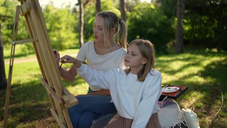 sisters painting outdoors