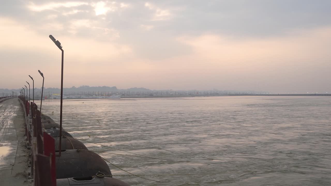 Ganga or Ganges river flowing heavily and flooding during Monsoon season at Prayagraj or Allahabad Sangam in Uttar Pradesh