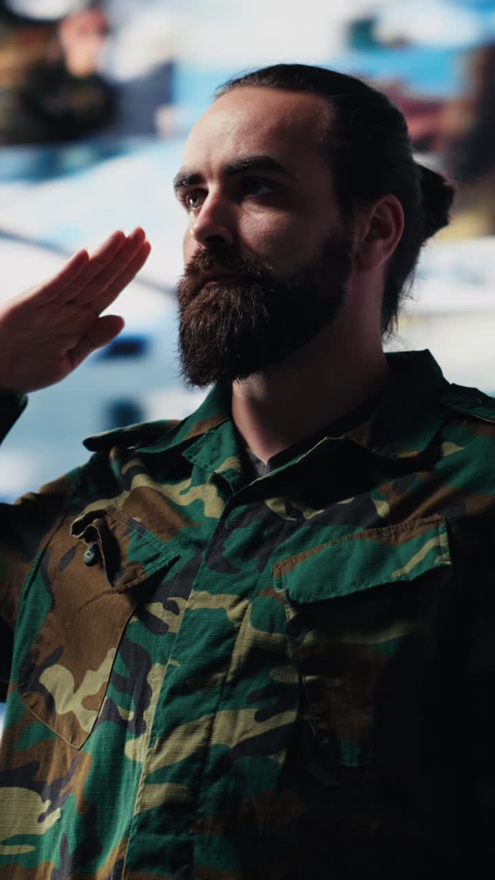 Vertical Video Army officer executes the respectful military salute in command center