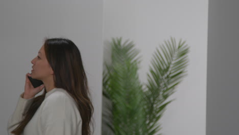 angry anxious or stressed woman having argument on mobile phone at work in office building 2