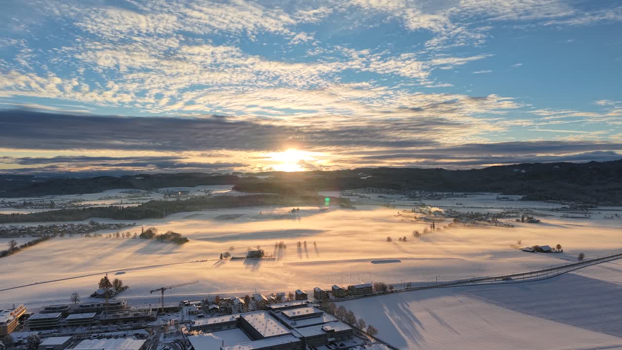 cloudy sunrise in winter landscape. relaxed drone shot by dji mavic air 3s.