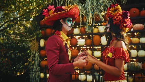 couple in day of the dead costumes
