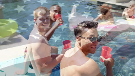 animation of flag of america over happy diverse friends relaxing by pool and drinking in the sun