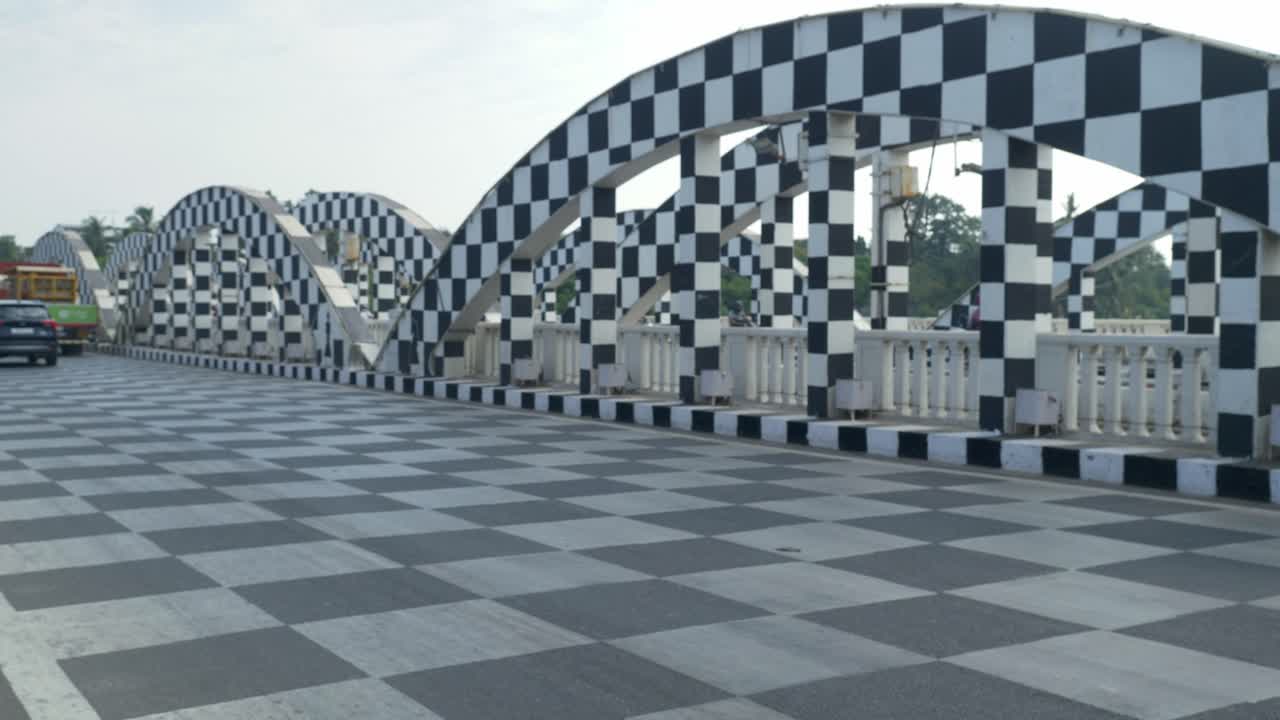 Cinematic shot of moving traffic at Napier Bridge transformed into a chessboard, Chennai, India