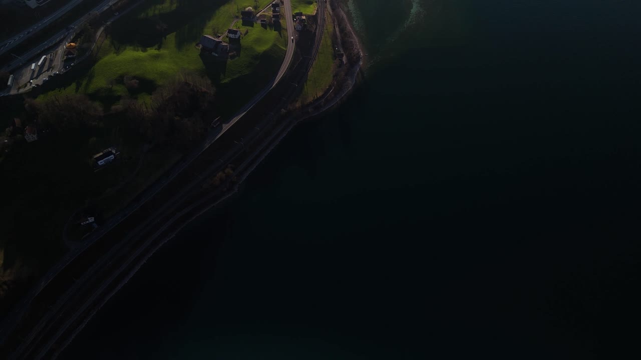 Aerial above road in Switzerland overlooking Lake Walen Walensee Swiss highlands