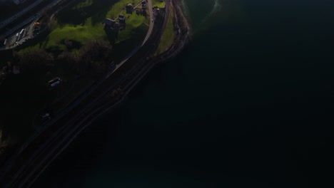 aerial above road in switzerland overlooking lake walen walensee swiss highlands