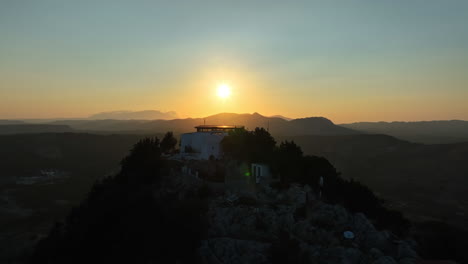 Aerial view orbiting the Tsampika Monastery, sunny evening in Rhodes, Greece