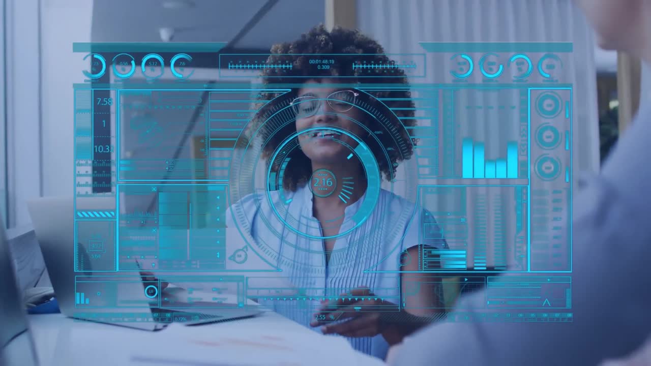 Animation of data processing on screen over african american businesswoman