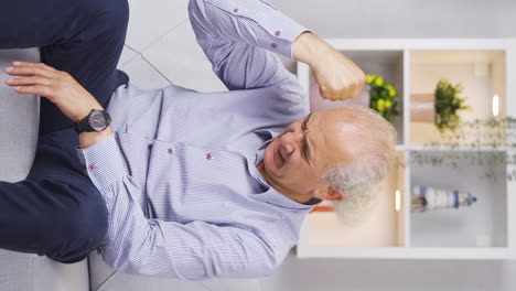 Vertical-video-of-Old-man-angry-with-himself.