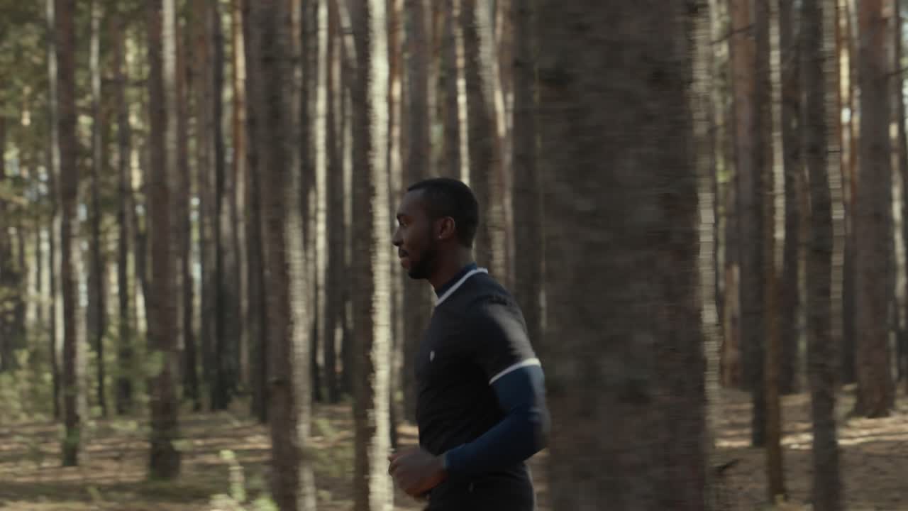Man Running in a Pine Forest
