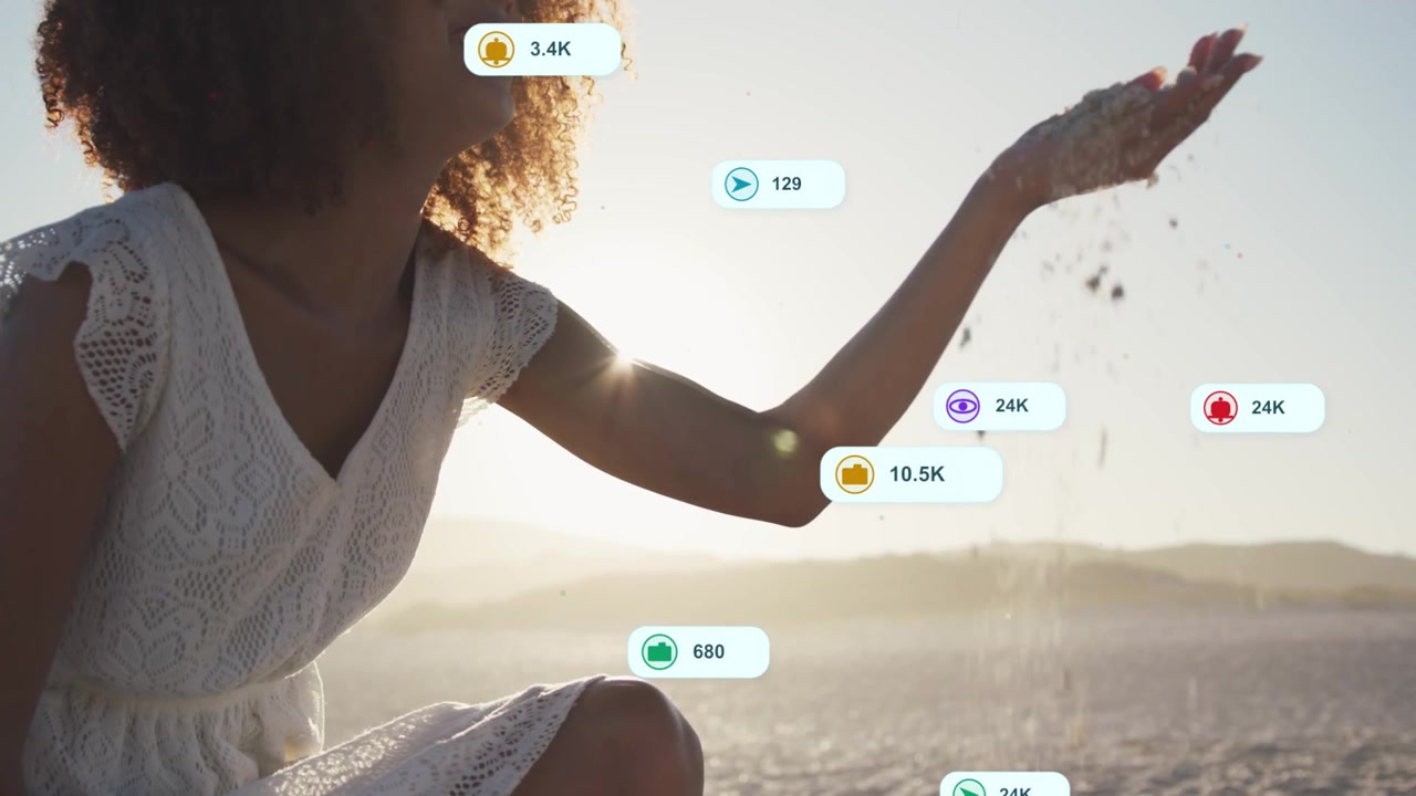 Woman kneeling on beach letting sand fall, sparking marketing bubbles around arm showing growth
