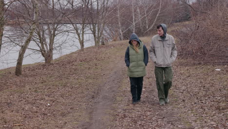 couple walking in a park on a cloudy day