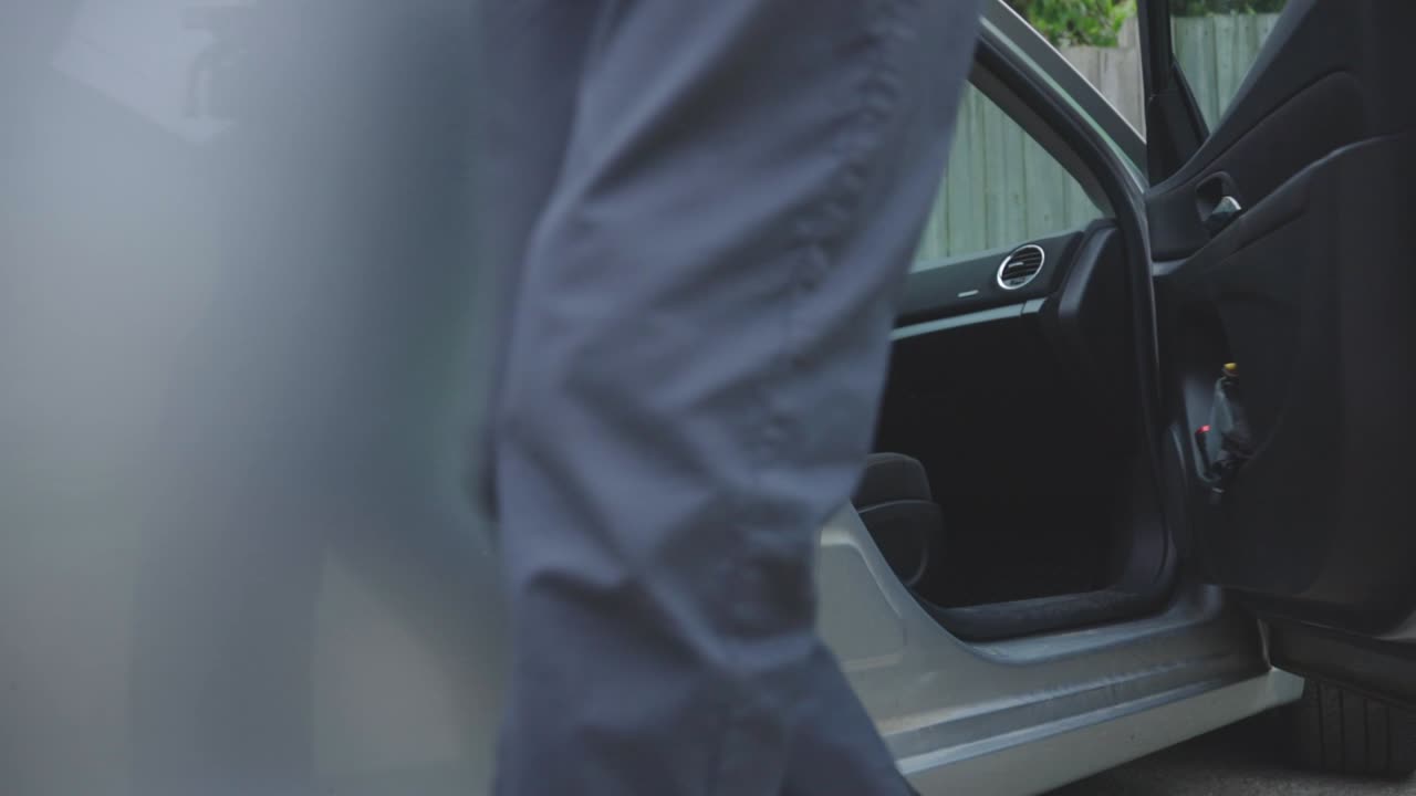 A Man Getting Off The Car From The Passenger Side - close up slowmo