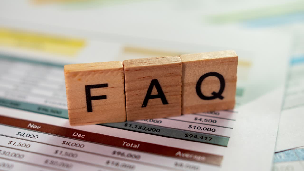 Zooming into faqs essential business insights for financial clarity office document review close-up