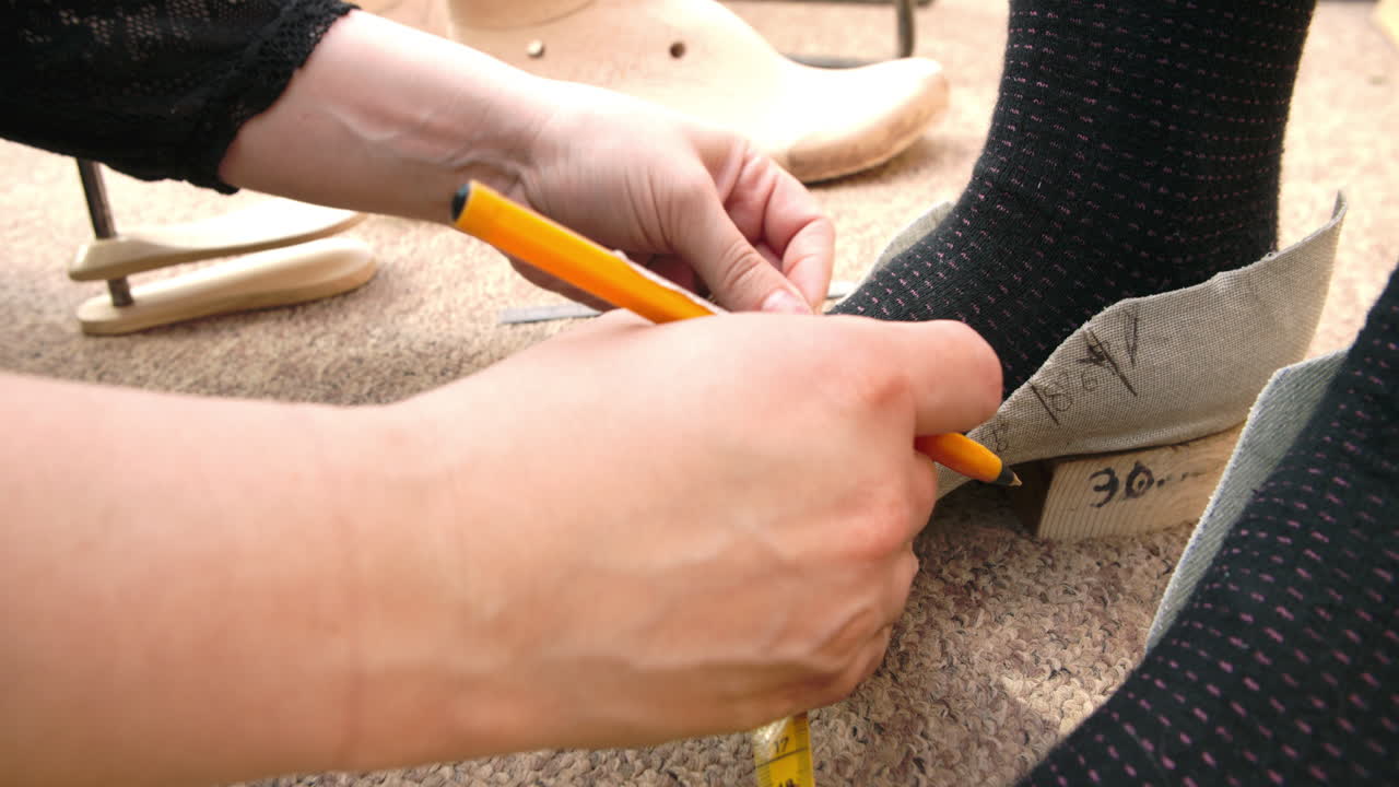Bespoke Shoemaker Measuring Customer's Foot For Shoe