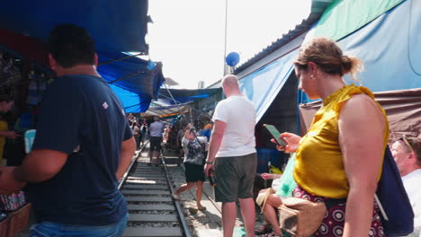 bangkok street market on train tracks