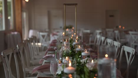 beautifully arranged long table setup for a wedding reception, adorned with delicate candles, fresh flowers, and all the details that contribute to a romantic and stylish ambiance