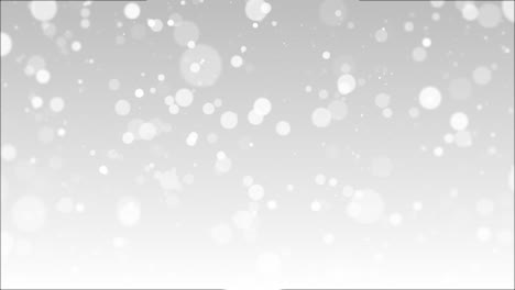 gentle movement of white glowing bokeh particles creating smooth dreamy atmosphere for celebration