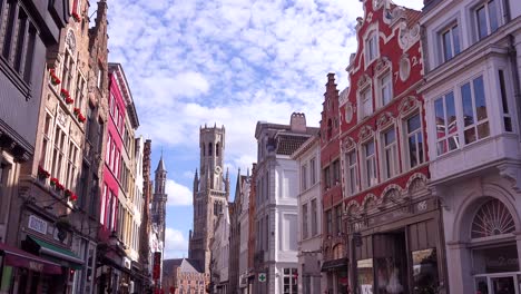 establishing shot of apartments and homes in bruges belgium with cobblestone street 3