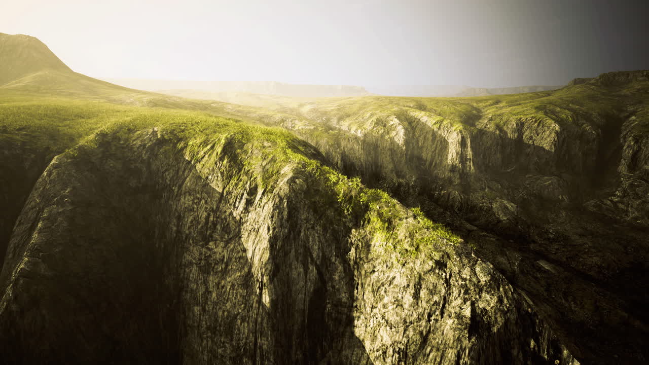 Mountainous terrain under soft sunlight with lush greenery on rocky slopes