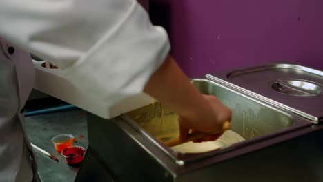 Worker-filling-mould-with-melted-chocolate